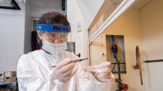 Scientist working with a transistor in the lab.