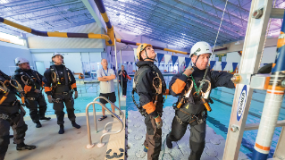 UD researchers setting up a training next to a pool to simulate actions they'll take in the field.