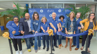 Blue ribbon cutting ceremony for Center for Intercultural Engagement. 