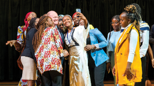 10th cohort of Mandela Washington Fellows on a stage.