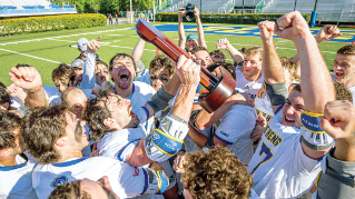 Mens Lacrosse Team celebrates after a win.