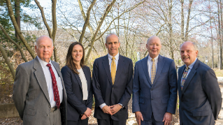 Top Justices standing outside in the woods.