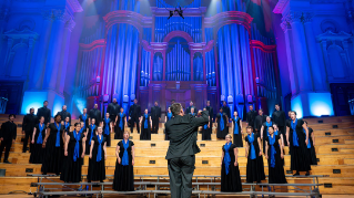Delaware Choral Scholars performing on stage.