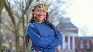 Stacy Mahinga posing on the Green.