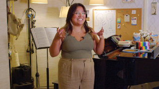 Alondra Gonzalez poses next to her music stand.