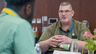 Disaster Research Center event attendees engaged in conversation.