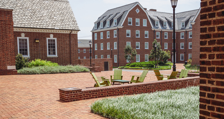 chairs sit in a common outdoor space around South Central residence halls