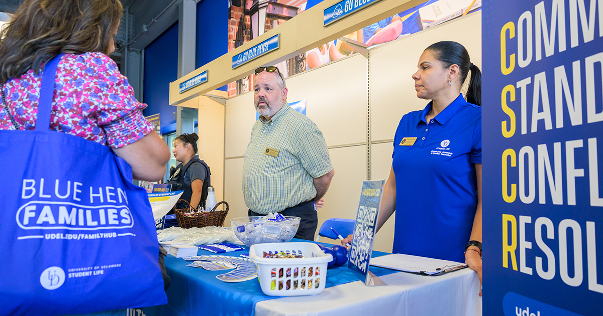 Community Standards & Conflict Resolution staff members talk to parents during 2023 Welcome Days