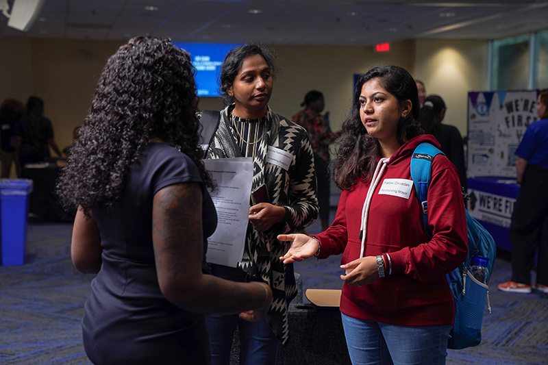 Students speak with CAM staff at the Welcome Event