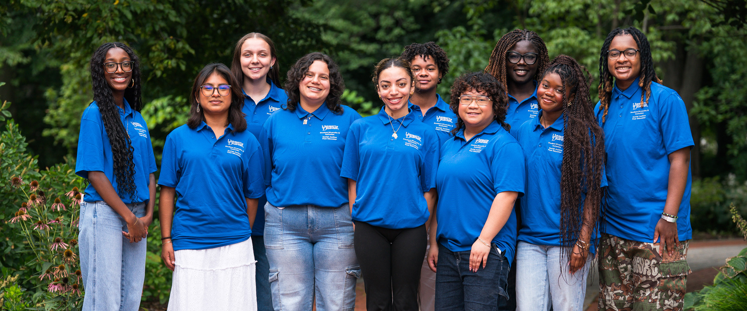 the group of Social Justice Peer Educators poses for a smiling photo
