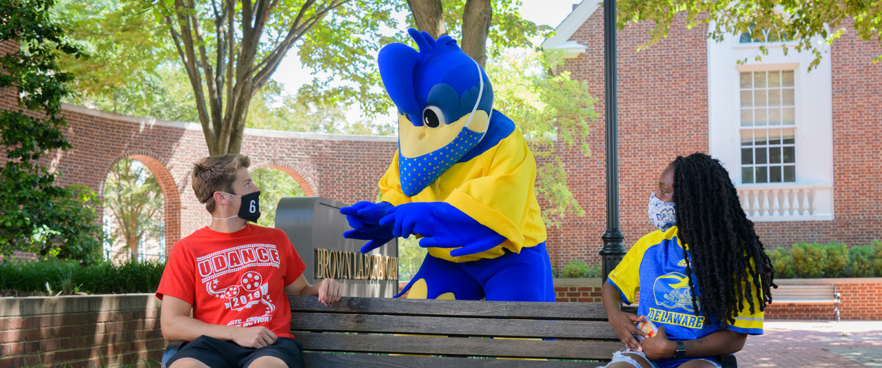 YoUDee and two students wearing masks