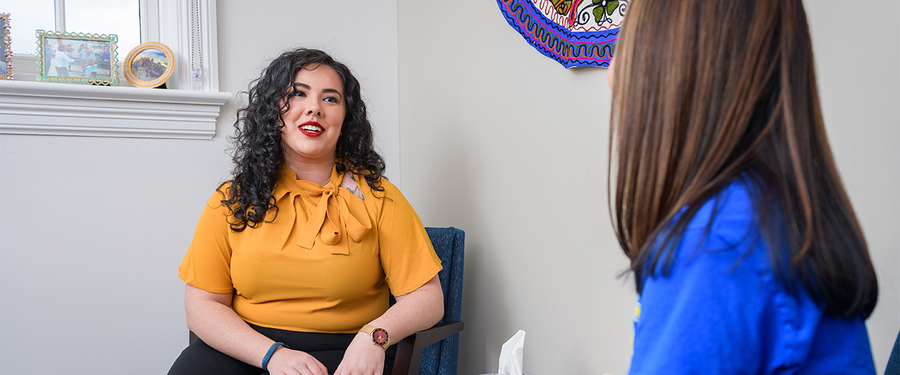 Wellbeing staff member consults with a student