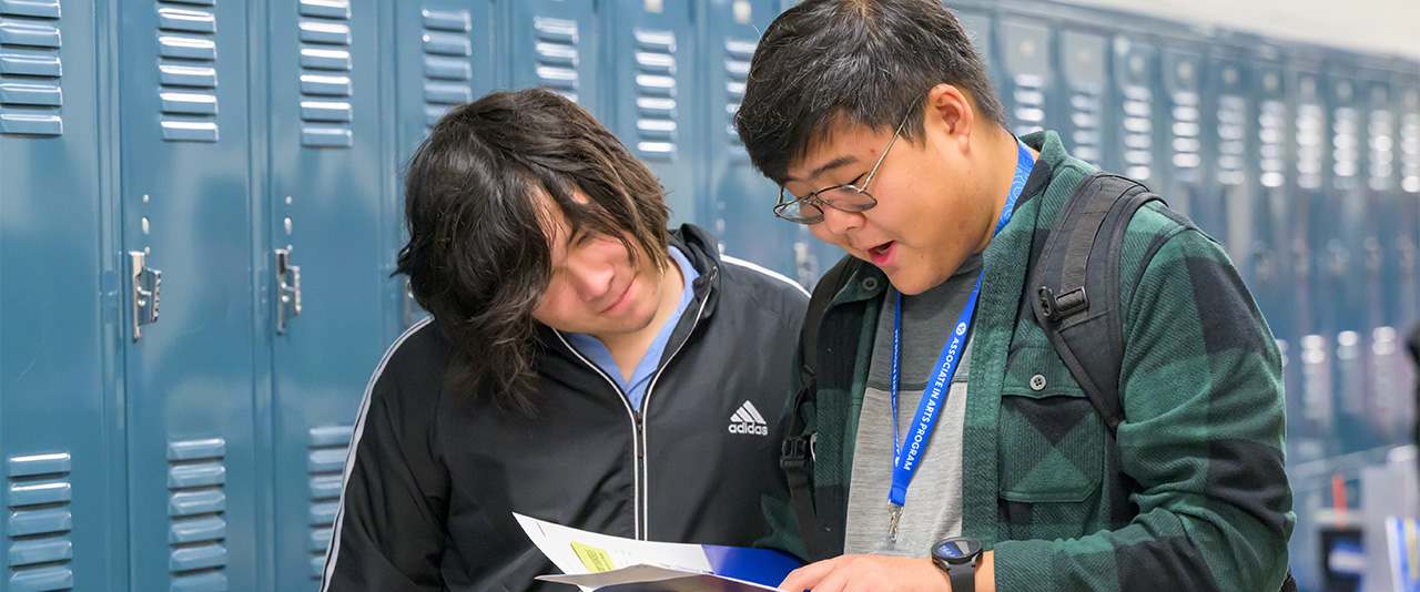 Flex Pathway students in Wilmington reviewing a resource packet