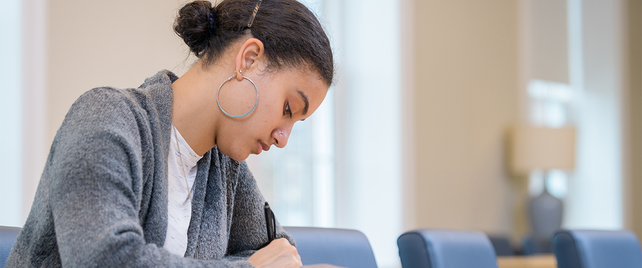 Female student fills out paperwork