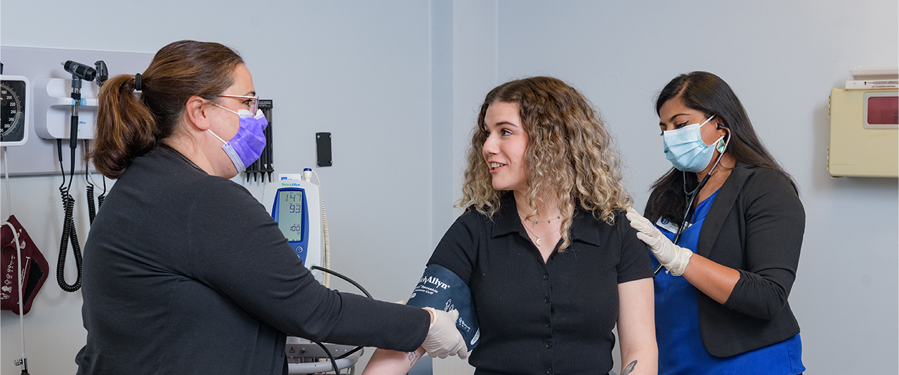 A student has their blood pressure checked in the Primary Care Clinic