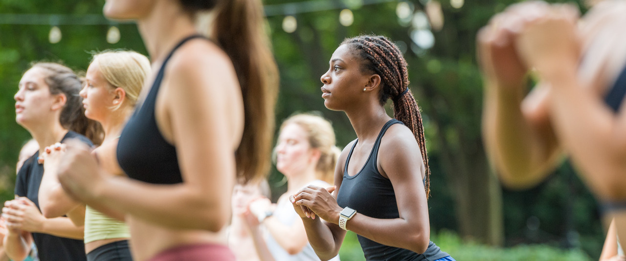 Students practice Zumba on The Green