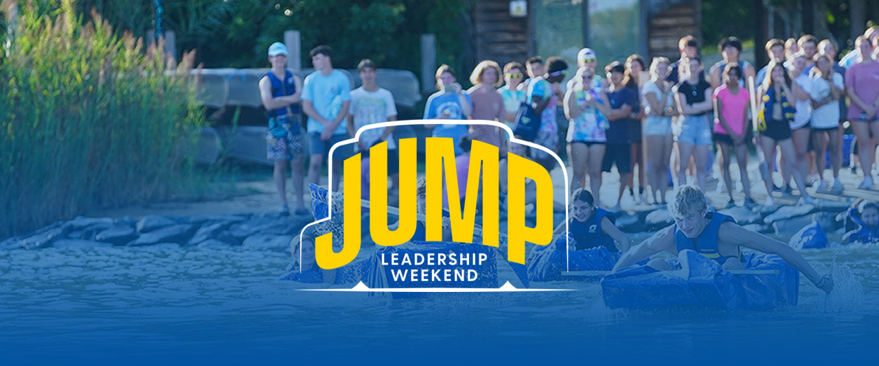 Student padding homemade canoes