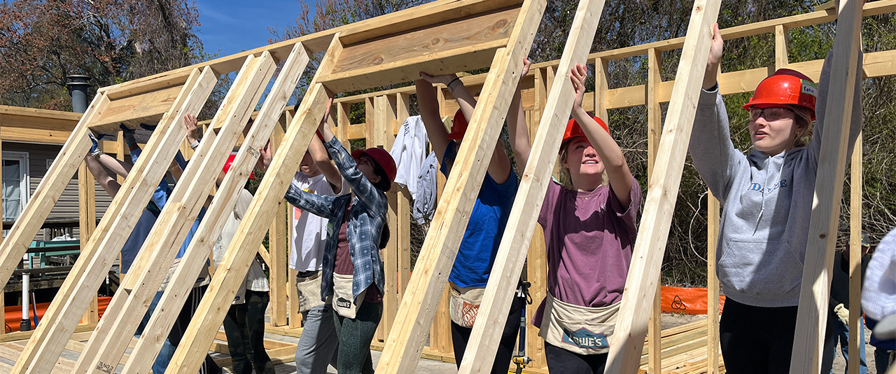 Students build framing for a home with Habitat for Humanity