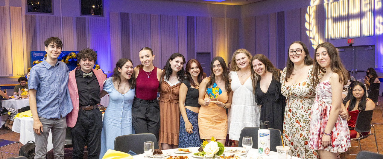 Students pose with their trophy during the YoUDee Awards ceremony