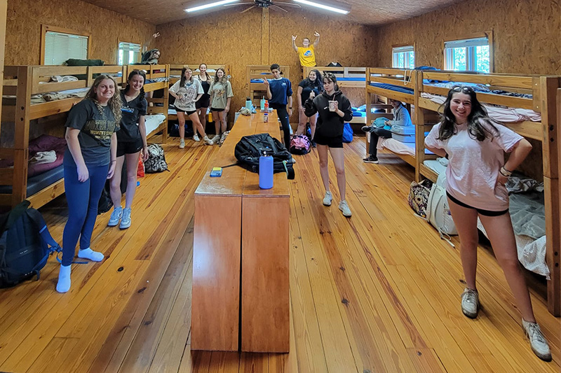 Students unpack in their cabin