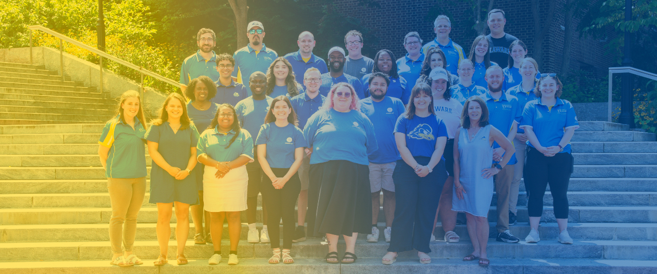 Smiling photo of RLH staff on the steps of Caesar Rodney