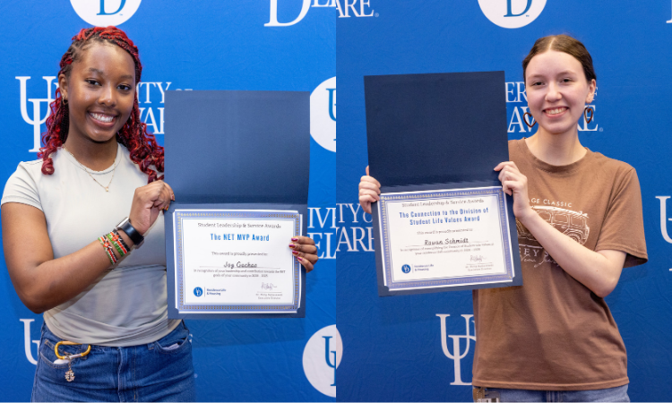 Students holding award certificates