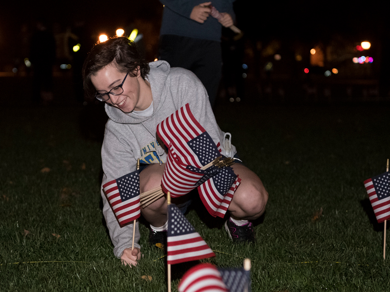 Air Force ROTC cadet Allison Chinnery helps with flag planting on The Green on Monday as part of Veterans Week. Air Force ROTC cadet Allison Chinnery helps with flag planting on The Green on Monday as part of Veterans Week.