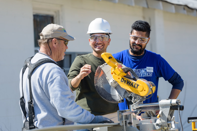 UD international students learned about constructing a home while helping a Sussex County family.