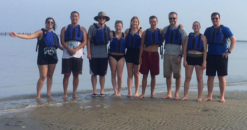 Students on the beach in Lewes, Delaware during Summit by the Sea 2017.