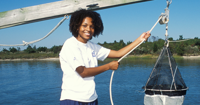 Letise LaFeir pictured during her time at UD conducting a plankton tow off of a pier at UD’s Hugh R. Sharp Campus in Lewes, Delaware.