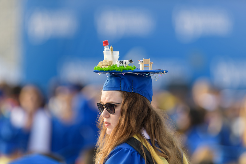 A graduate of the College of Agriculture and Natural Resources shows off her decorated cap at Commencement.