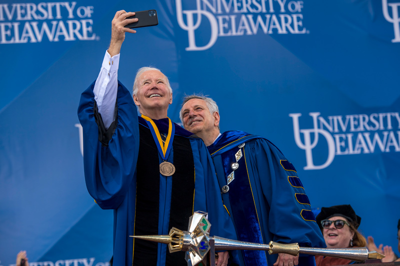 President Joe Biden and UD President Dennis Assanis take a selfie, a UD graduation tradition.