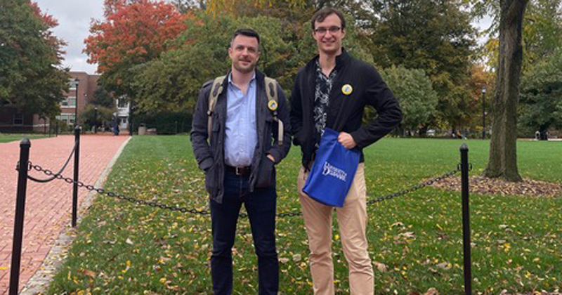 Alumni Paul King and Neil Redfield return to campus to organize a college tour for New York City high school students.