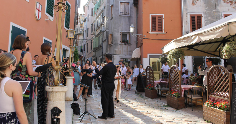 The Delaware Choral Scholars perform in an evening pop-up street concert in Rovinj, Croatia.