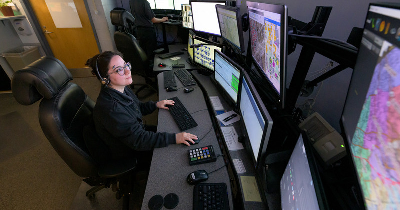 Shelby Ricketts, a UD Police Department dispatcher, views computer-aided dispatch and mapping systems in UDPD’s Communication Center. The Comm Center is staffed 24 hours a day, seven days a week, for 365 days each year.