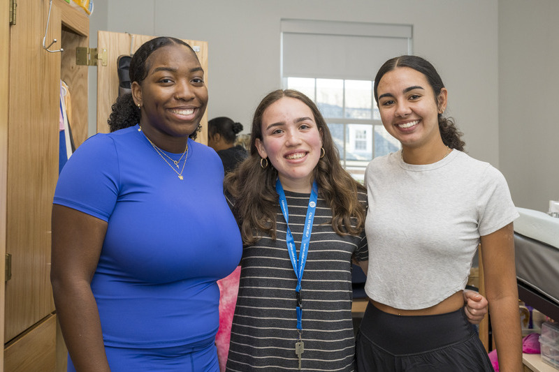 New Blue Hens Deaira Lopez, Anna Moetzinger and Mariah Maddox move into South Academy Hall. Bridgeville natives Lopez and Maddox attended the same high school.