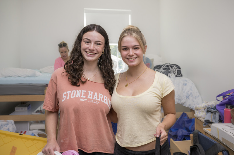 Haverford, Pa., natives and long-time friends Sophia Angelini and Sarah Stollsteimer get settled into their South Academy Hall room.