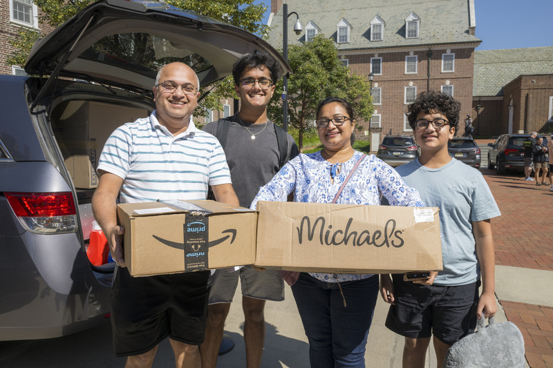 New UD student Agrim Gupta (second from left) gets a helping hand on Move-In Weekend from his father Chhavi, mother Praveen and brother Sanidhya.
