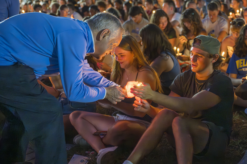 President Assanis lights a candle