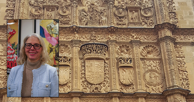 image of professor and a beautiful sculpted wall 