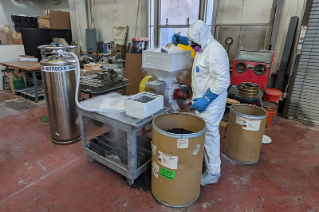 grad student creating pavers made from plastic waste
