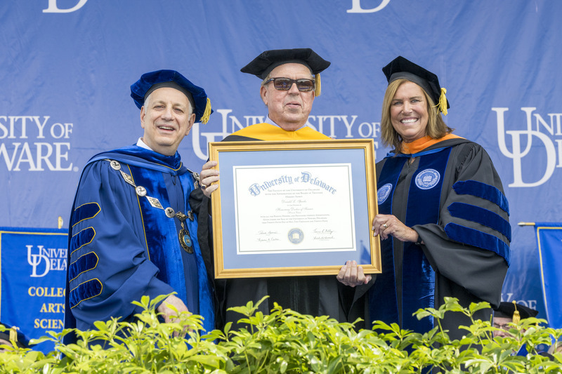 UD Professor Don Sparks, the Unidel S. Hallock du Pont Chair in Plant and Soil Sciences and former director of the Delaware Environmental Institute, is congratulated on his new honorary doctor of science degree by UD President Dennis Assanis (left) and Board Chair Terri L. Kelly (right).