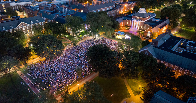 UD’s newest students gather on The Green for the University’s Twilight Induction Ceremony, a ritual that welcomes to campus all new students and marks the official start of their time at UD.