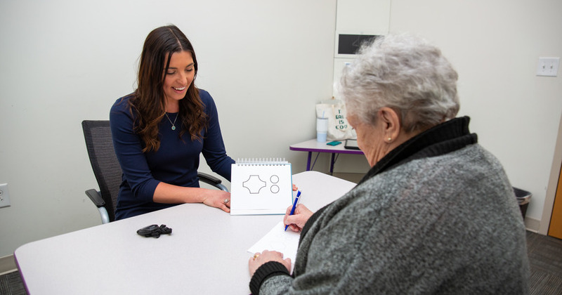 As part of the data collection process for DementiaBank, Alyssa Lanzi (left), assistant professor of communication sciences and disorders, conducts a comprehensive battery of cognitive and language tests.