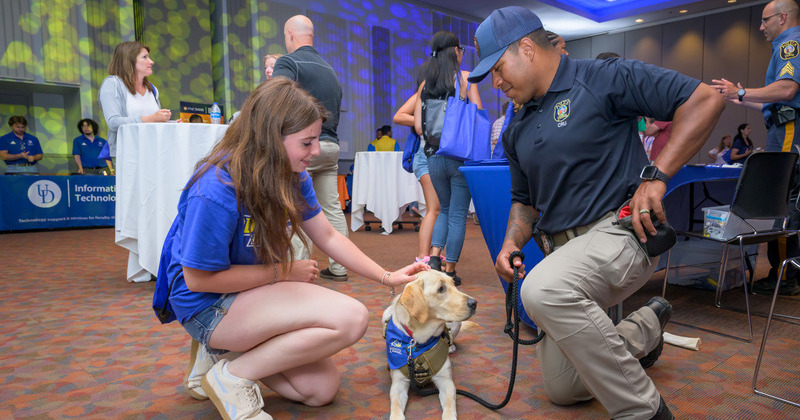 Patti, a 17-month-old yellow labrador, is the University of Delaware Police Department's newest member and first facility dog. In her official UDPD duties, Patti offers mental health and wellness support to the department’s officers and staff. She also provides opportunities to build trust and community through engagement with Blue Hens and the general public, and she is available to UDPD for critical incident response and offering support to victims and witnesses.
