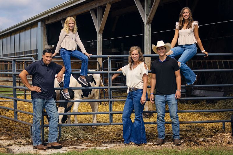 The Knutsen family posing at their dairy farm.