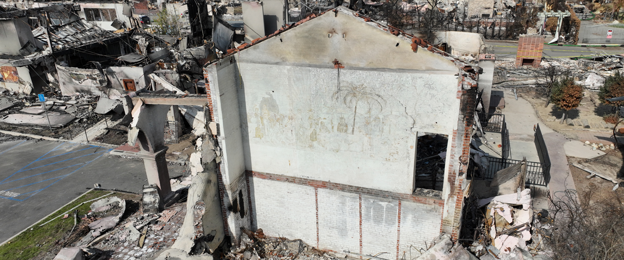 Fire ravaged the Pasadena Jewish Temple and Center in January, leaving only one wall standing. The façade of the wall was burned away, revealing a mural no one knew was there. The mural is visible in this site photo. The wall has since been demolished as part of the U.S. Army Corps of Engineers’ work to remove hazardous waste in the area.