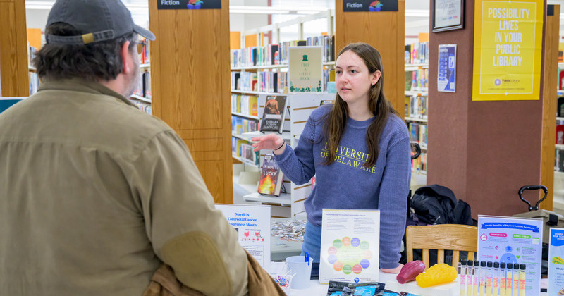 A student sharing health promotion materials
