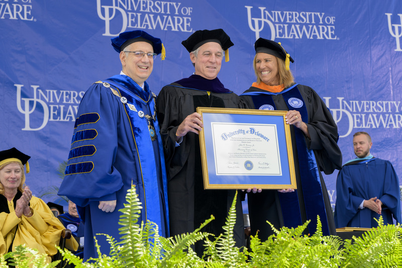 UD President Dennis Assanis (left) and Board Chair Terri L. Kelly (right) awarded John C. Carney Jr., former Delaware governor and current Wilmington mayor, with an honorary doctor of laws degree.