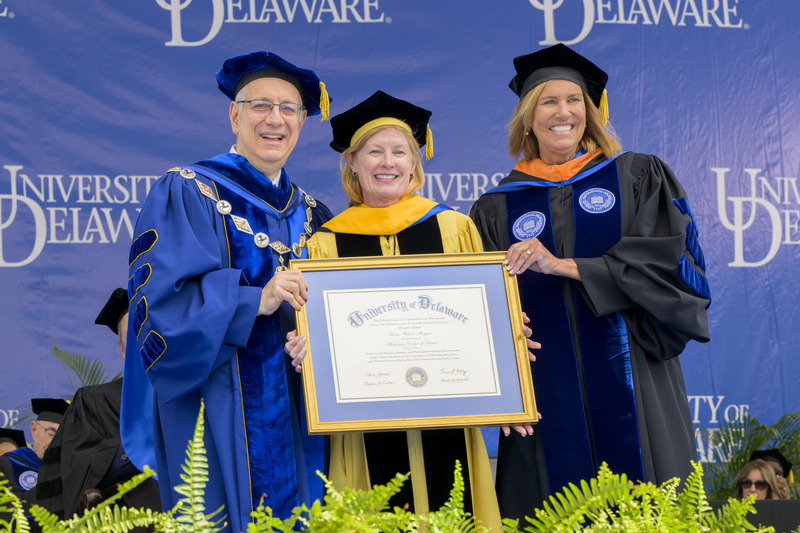 UD President Dennis Assanis (left) and Board Chair Terri L. Kelly (right) awarded an honorary doctor of science degree to former UD Provost Robin Wilson Morgan.